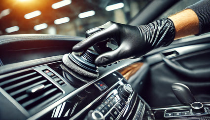 a detail black nitrile glove being used in a car detailing